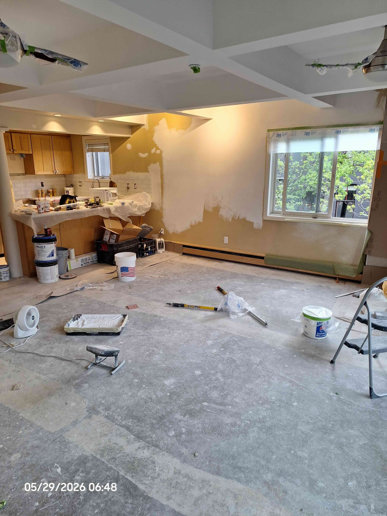 Aspen condo remodel in progress with drywall repairs, fresh primer, and kitchen renovation at Aspen Square Condominiums.